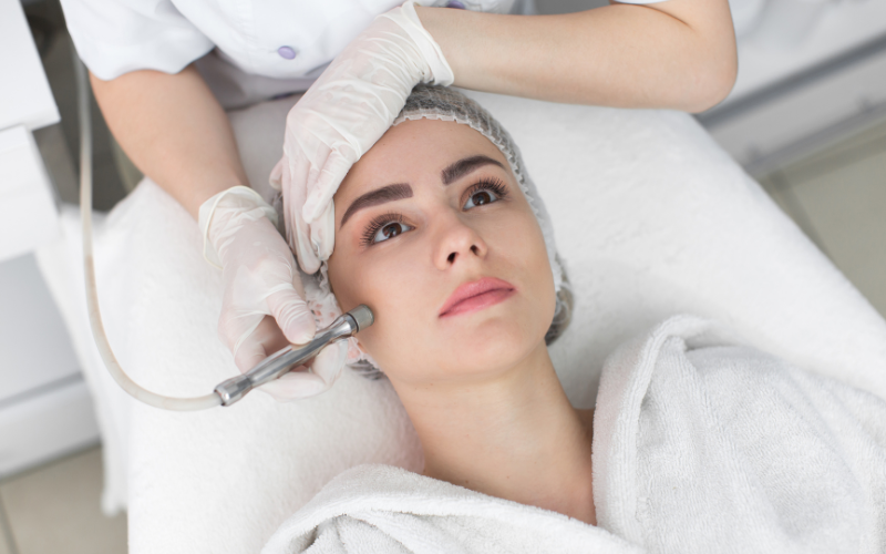 woman laying and Microdermabrasion and facials done