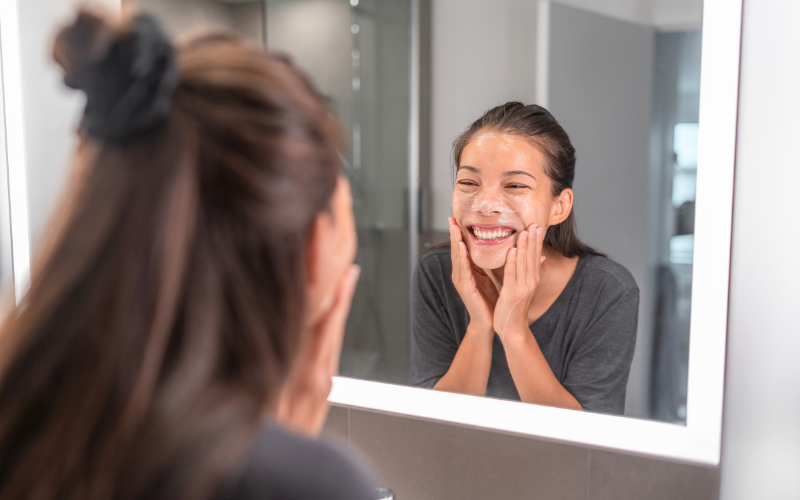 girl applying Gentle Cleanser on face