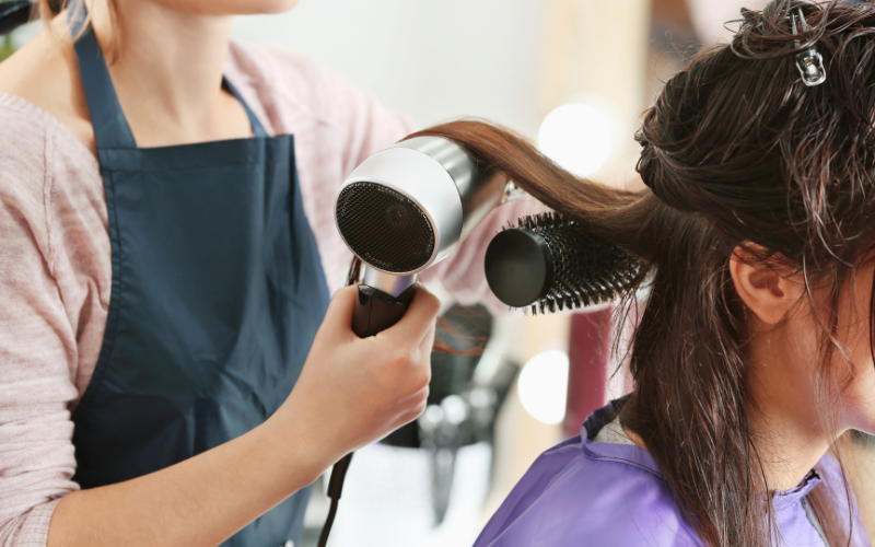 girl Blowdrying her hair