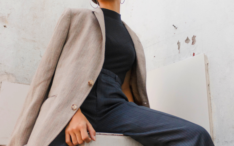 girl in dark semi-formal with brown over coat