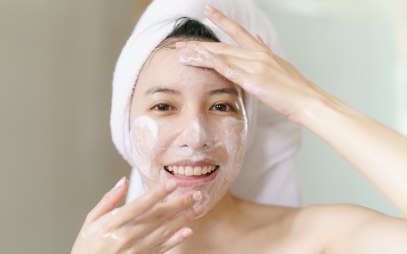 girl washing face with facewash