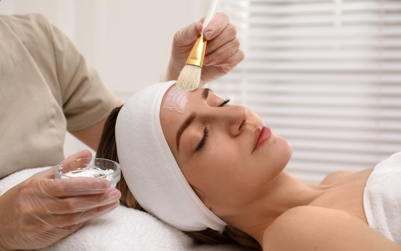 girl applying chemical on face