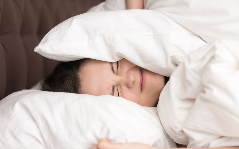 girl in bed with pillows