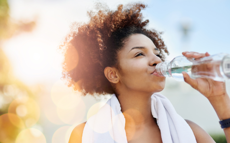 girl drinking water from bottle