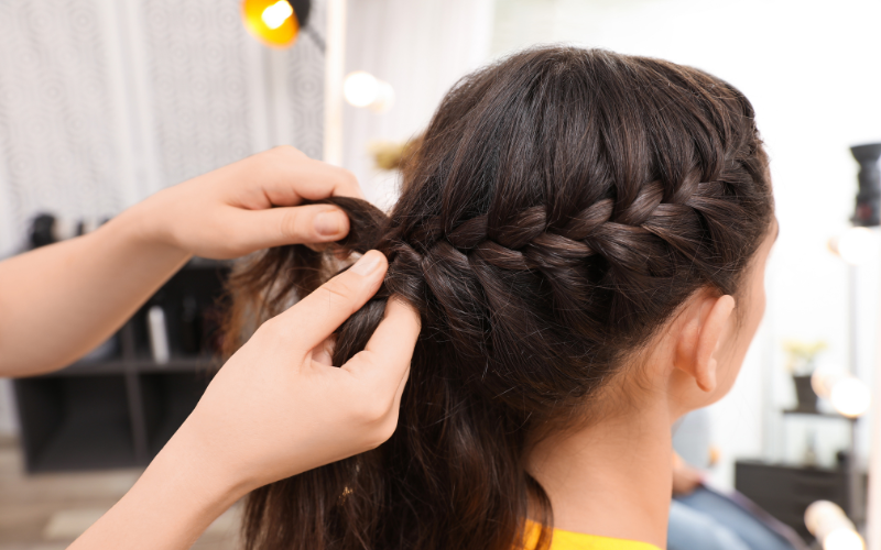 woman making braids