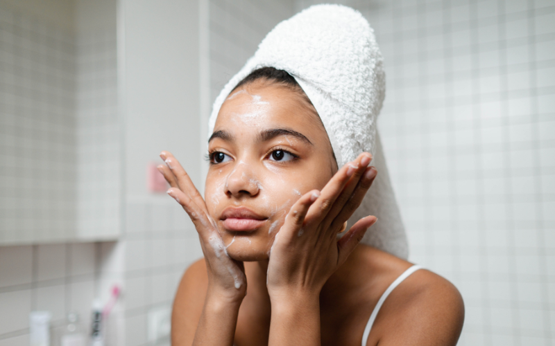 girl cleansing the face