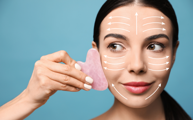 girl applying Gua Sha on face