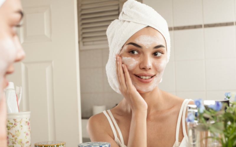 girl washing face with facewash