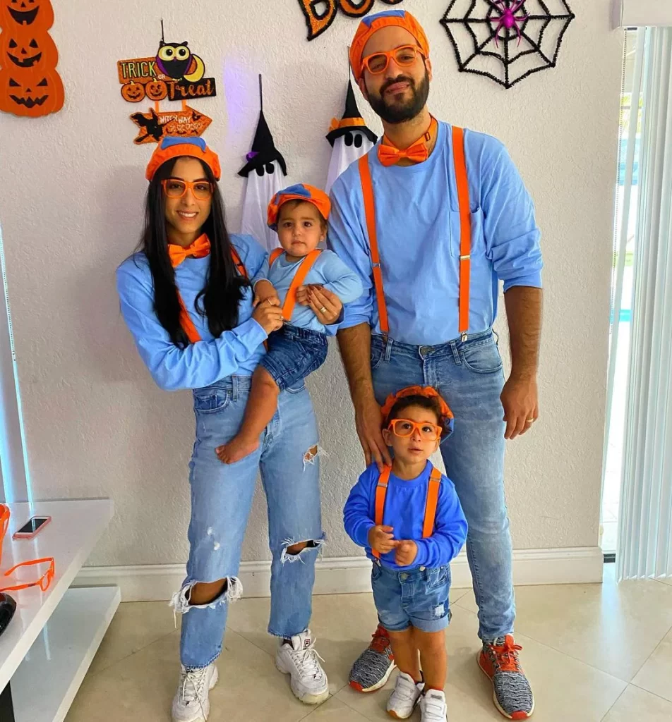 family in Blippi outfits