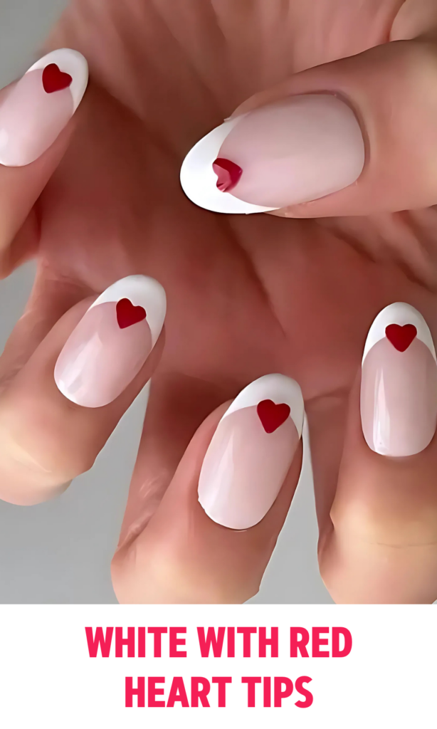 White nails with tiny red hearts on the tips