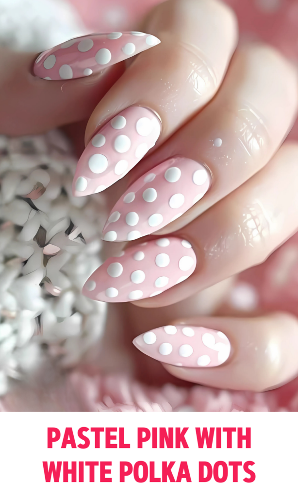 Pastel pink nails with tiny white polka dots