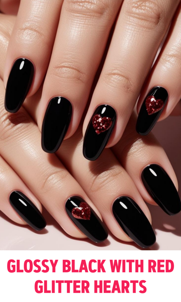 Glossy black nails with tiny red glitter hearts