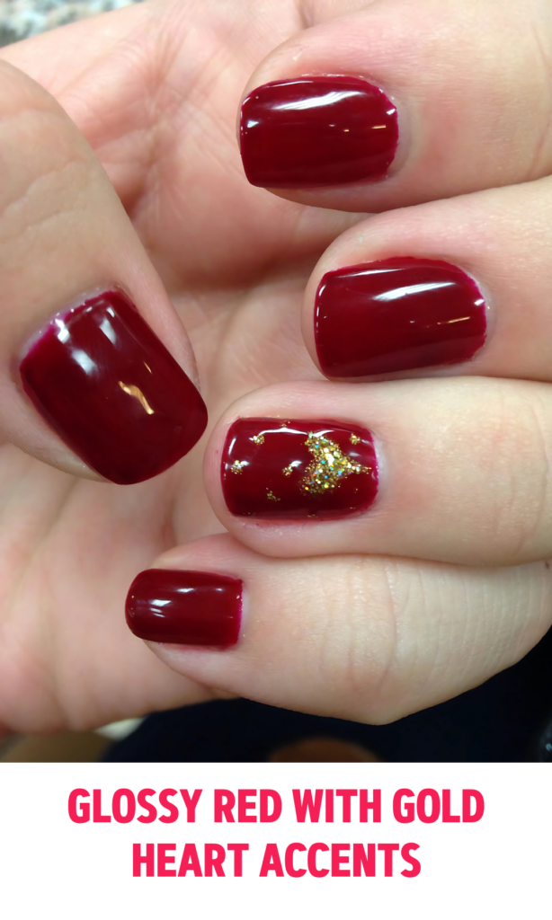 Glossy Red Nails with Gold Heart Accents