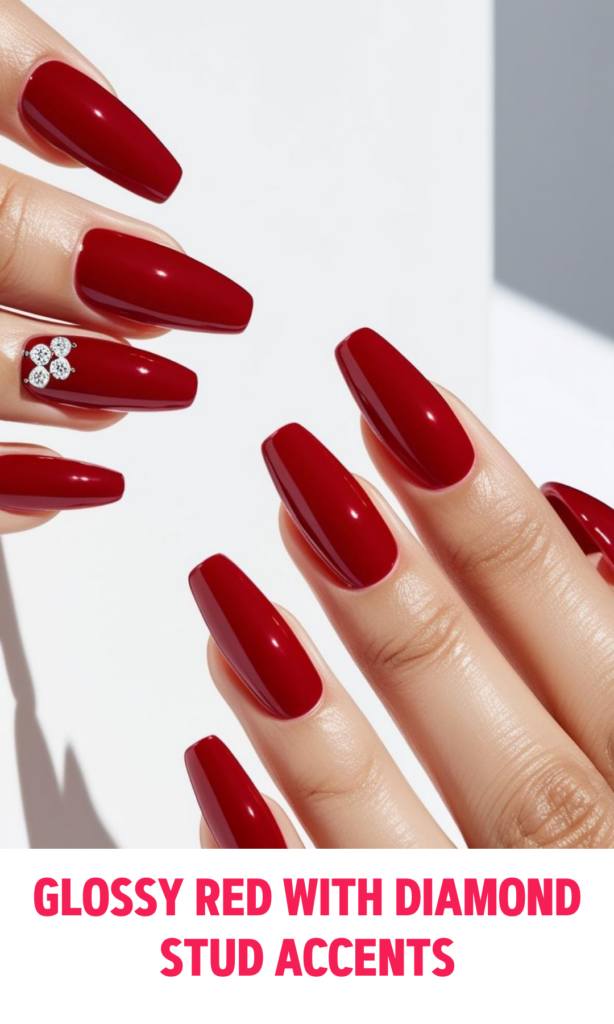 Glossy Red Nails with Diamond Stud Accents