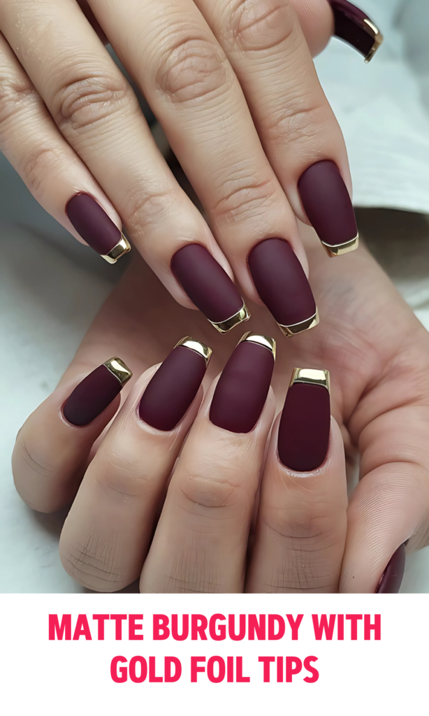 Matte burgundy nails with gold foil tips